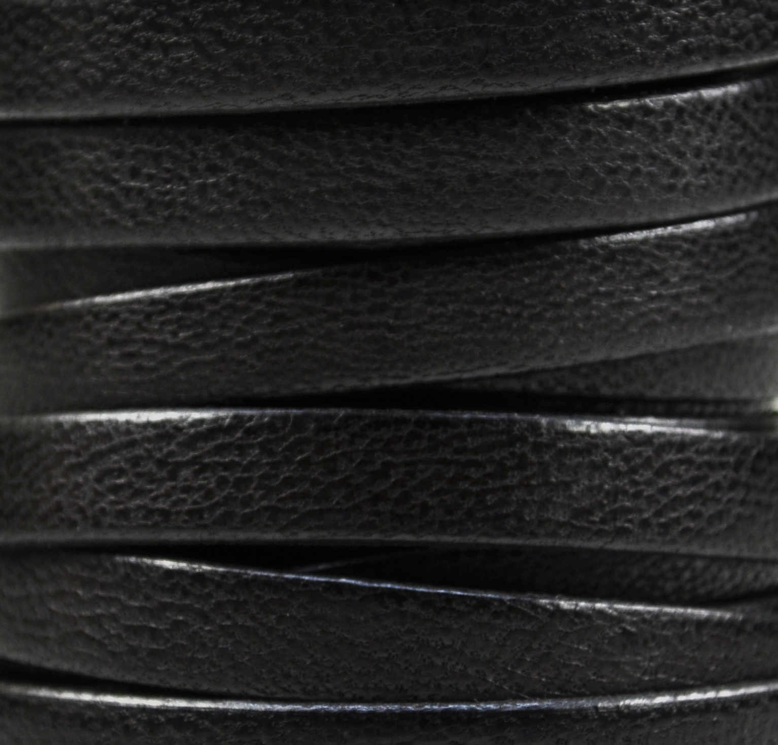 Riemchen Kamelleder 10 mm schwarz mit schwarzen Kanten, Preis für 10 cm